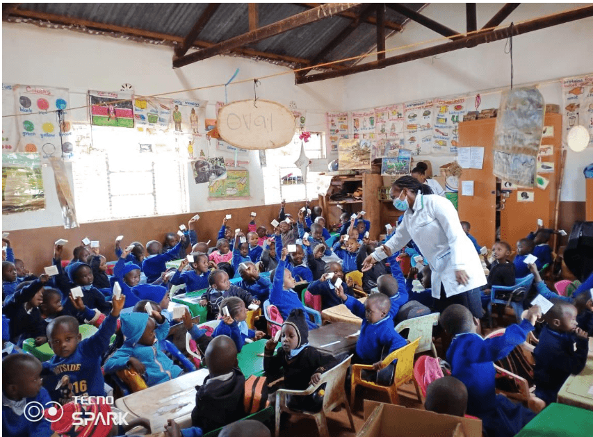 Community health education session with large group of participants